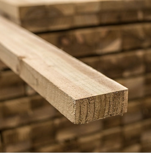 Close-up of a tanalised fence rail, measuring 4200 x 75 x 38mm, showcasing its sturdy and durable wood, ideal for fencing projects. Perfect for both residential and commercial landscaping.