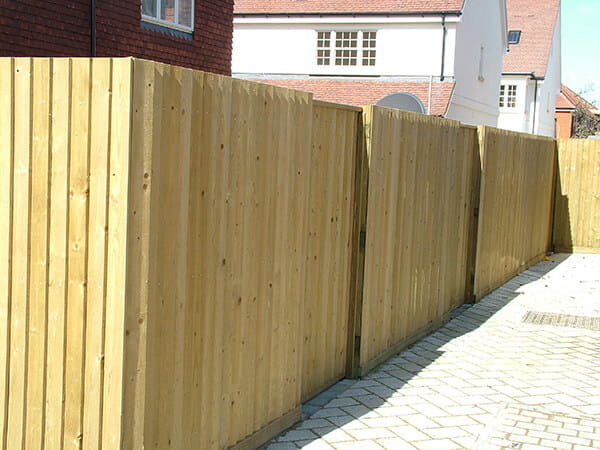 Wooden fencing installation showcasing premium Fencing Newcastle by Newcastle Turf, enhancing outdoor spaces with privacy and style.